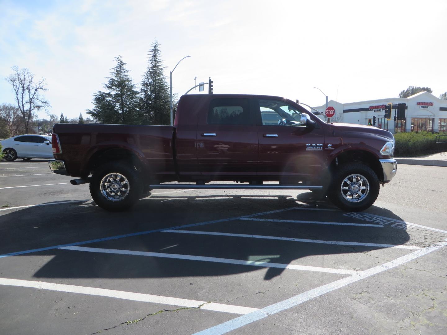 2017 MAROON /TAN RAM 3500 Laramie Mega Cab 4WD (3C63R3ML6HG) with an 6.7L V8 OHV 16V DIESEL engine, automatic transmission, located at 2630 Grass Valley Highway, Auburn, CA, 95603, (530) 508-5100, 38.937893, -121.095482 - Photo#3